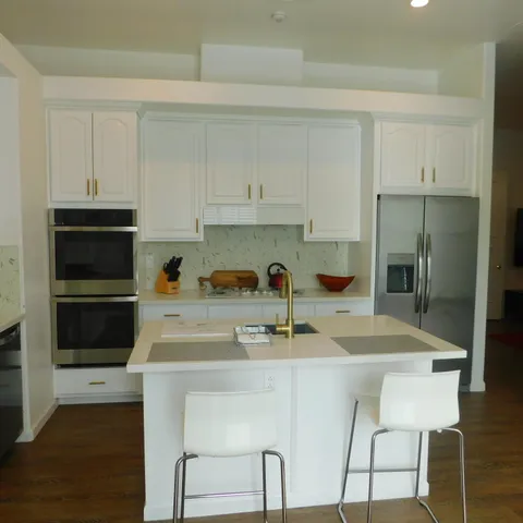 a bathroom with a shower a toilet and a sink