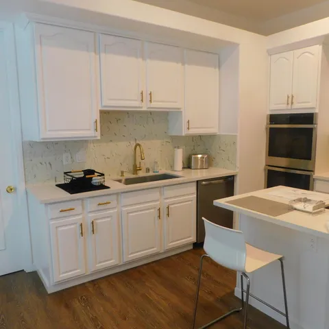 a view of a swimming pool with a yard