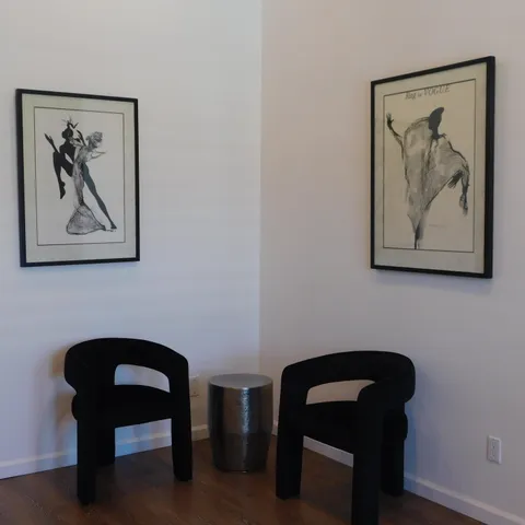 a kitchen with stainless steel appliances granite countertop a stove a microwave and white cabinets