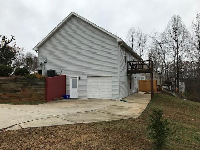 4086 Parks Road Flowery Branch, GA 30542 - Photo 14 of 23 a view of a house with a yard and garage