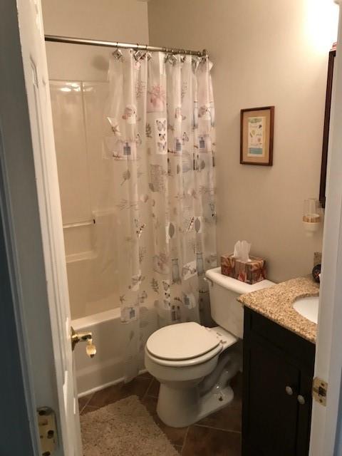 4086 Parks Road Flowery Branch, GA 30542 - Photo 19 of 23 a bathroom with a toilet a sink and shower