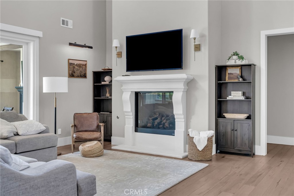 12237 Cortona Place Riverside, CA 92503 - Photo 13 of 60 a living room with furniture and a flat screen tv