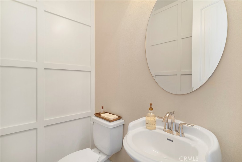 12237 Cortona Place Riverside, CA 92503 - Photo 19 of 60 a bathroom with a sink mirror and toilet