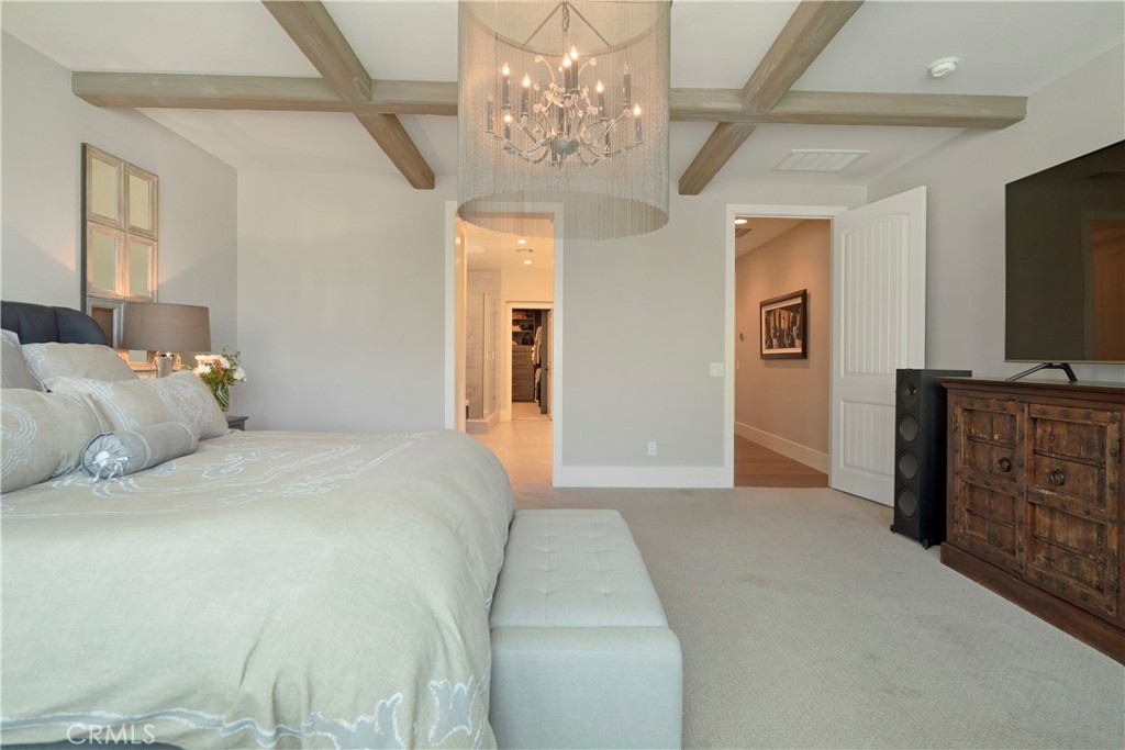 12237 Cortona Place Riverside, CA 92503 - Photo 22 of 60 a bedroom with a bed and a flat tv screen on dresser