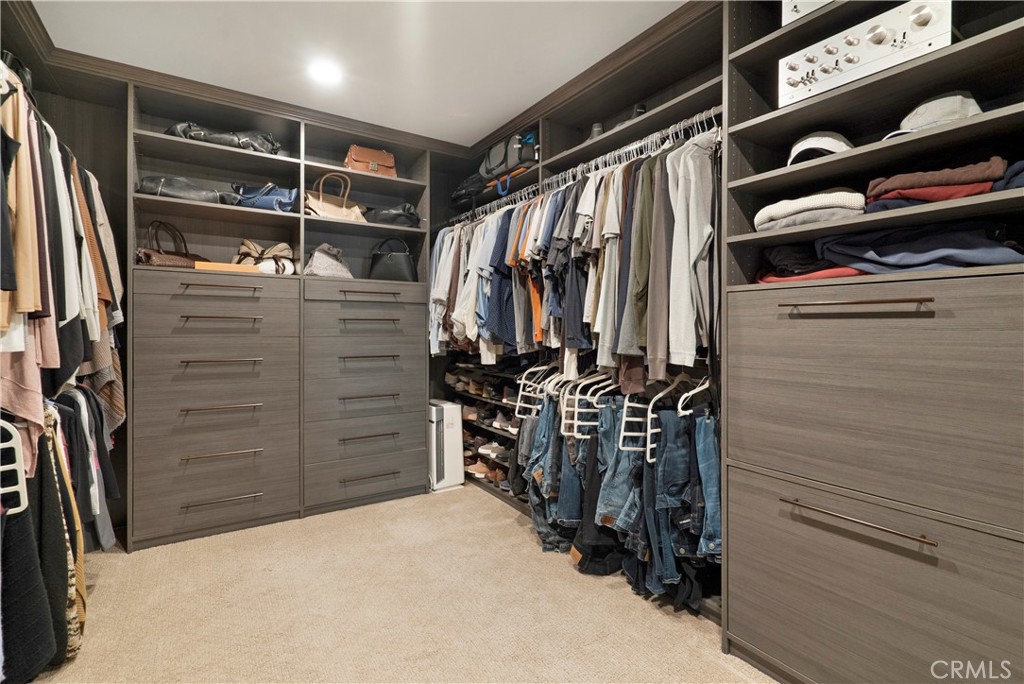 12237 Cortona Place Riverside, CA 92503 - Photo 27 of 60 a view of walk in closet with clothes and shoes