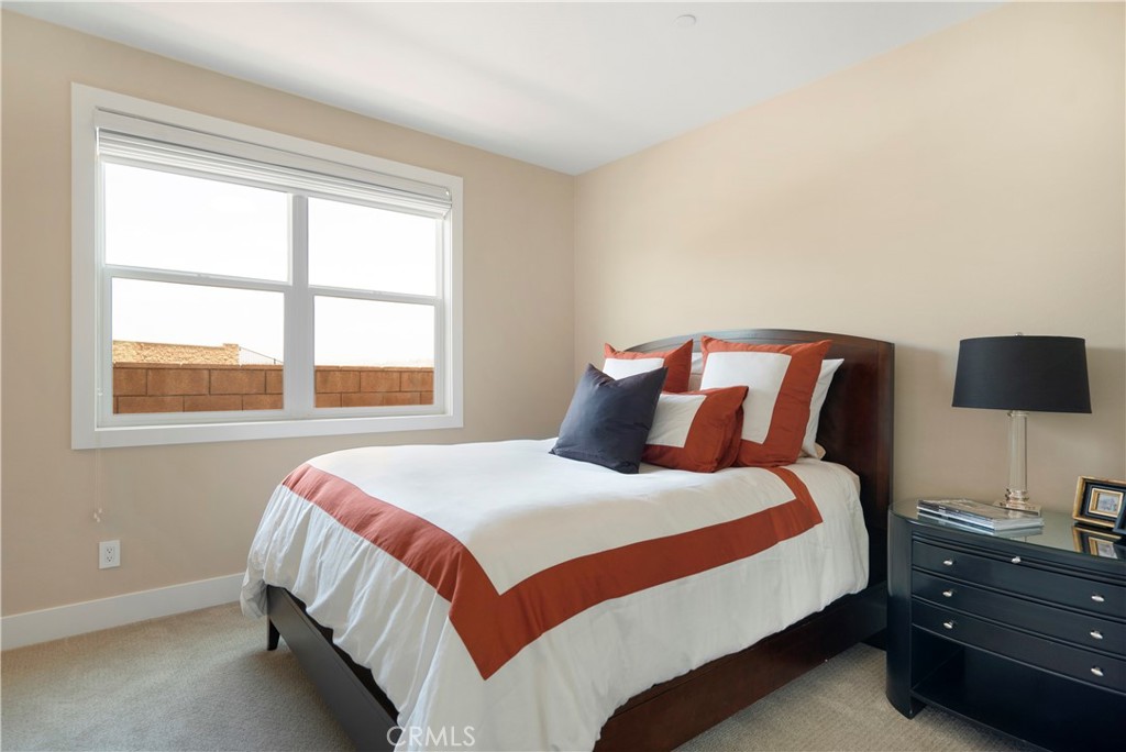 12237 Cortona Place Riverside, CA 92503 - Photo 28 of 60 a bedroom with a bed and a window
