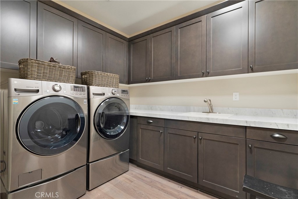 12237 Cortona Place Riverside, CA 92503 - Photo 31 of 60 a utility room with sink dryer and washer