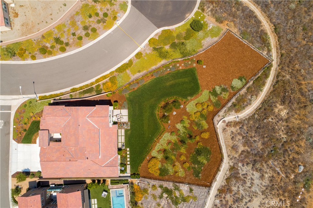 12237 Cortona Place Riverside, CA 92503 - Photo 35 of 60 an aerial view of a house with a swimming pool