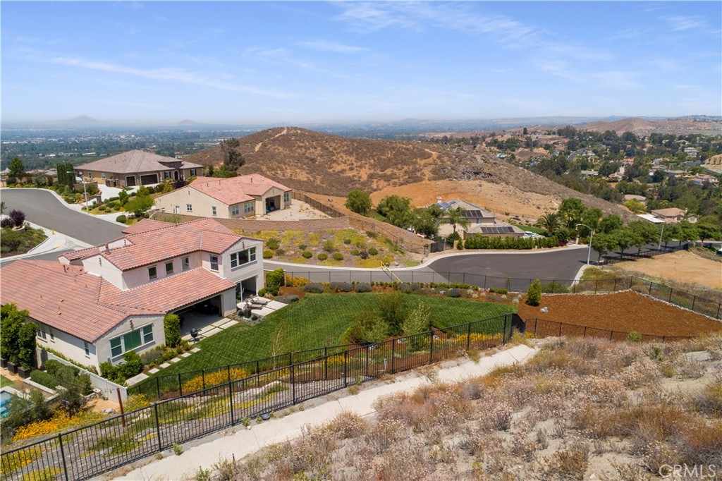 12237 Cortona Place Riverside, CA 92503 - Photo 37 of 60 an aerial view of residential houses with outdoor space and river view