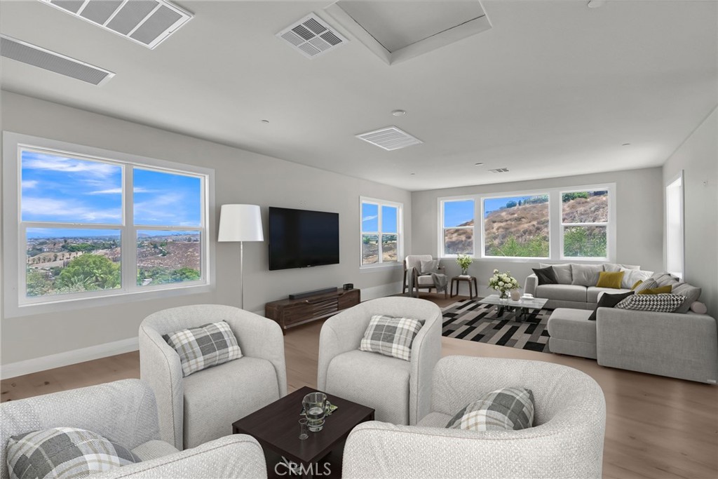 12237 Cortona Place Riverside, CA 92503 - Photo 43 of 60 a living room with furniture and a large window