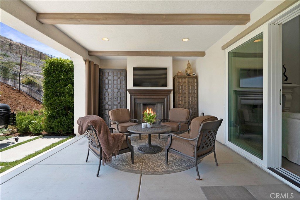 12237 Cortona Place Riverside, CA 92503 - Photo 49 of 60 a outdoor space with patio the couches and a fireplace