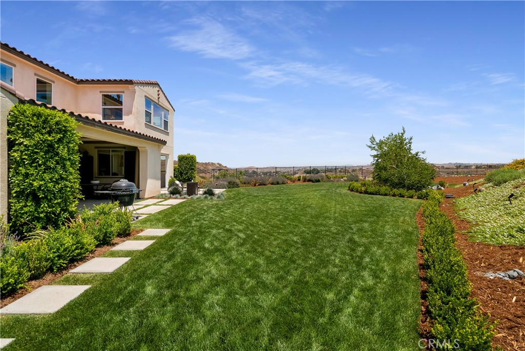 12237 Cortona Place Riverside, CA 92503 - Photo 52 of 60 a front view of a house with a yard