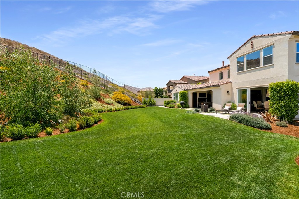 12237 Cortona Place Riverside, CA 92503 - Photo 56 of 60 a front view of house with yard and green space