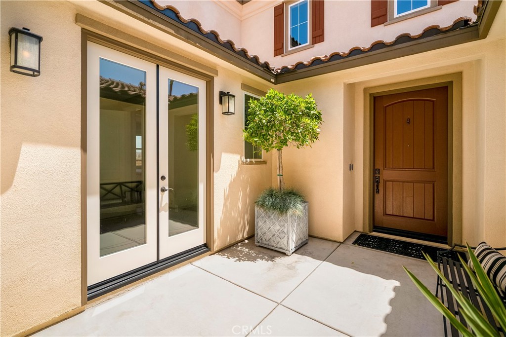 12237 Cortona Place Riverside, CA 92503 - Photo 8 of 60 a entryway view with a potted plant in front of door