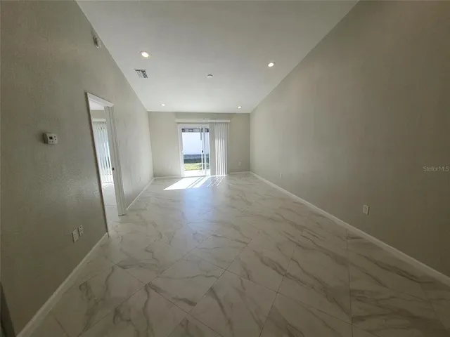 an empty room with windows