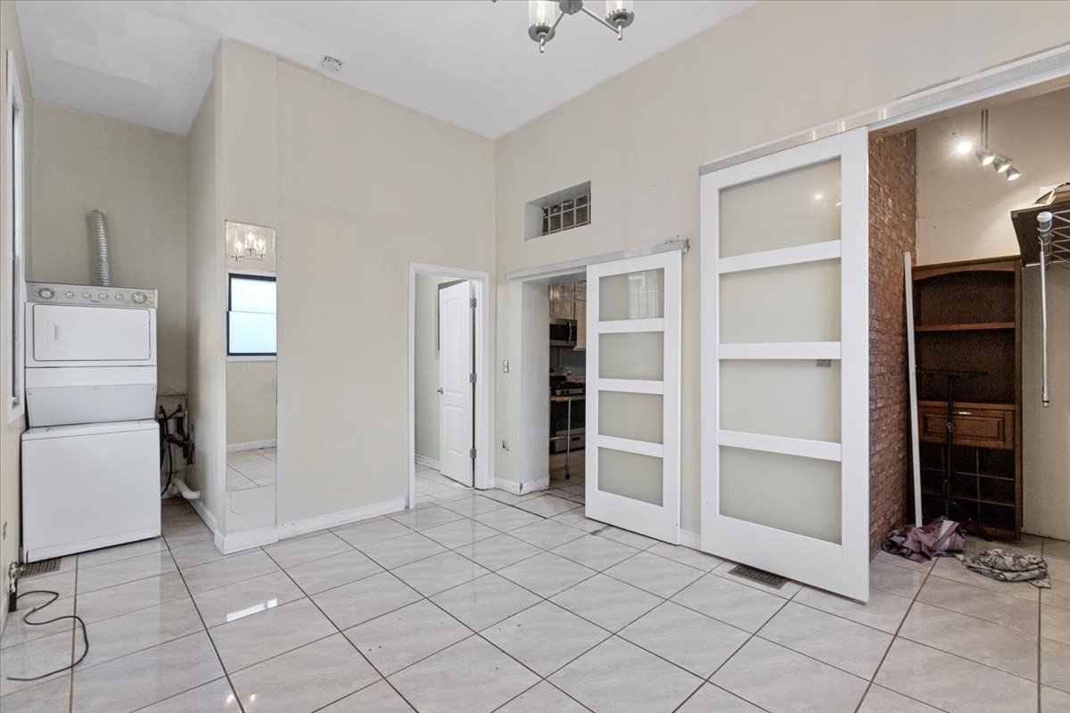 229 South Racine Avenue, Unit 1 Chicago, IL 60607 - Photo 9 of 10 a view of an empty room with cabinet and entryway