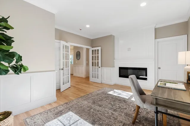 a living room with furniture a fireplace and a rug
