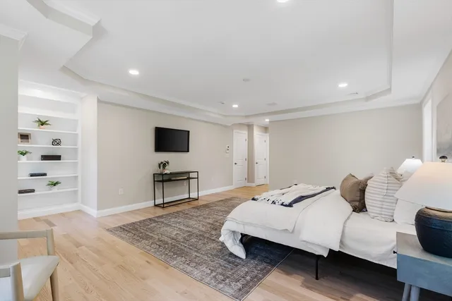 a bedroom with a bed and a television