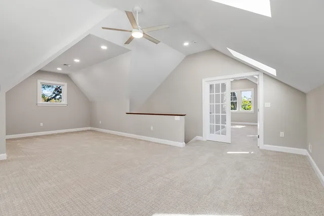 an empty room with windows and pillars in it