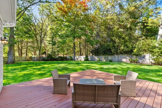 a view of a wooden deck and a yard