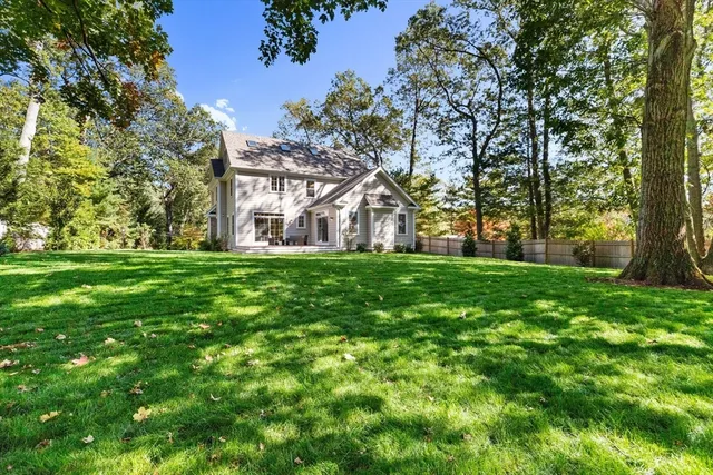 a front view of house with yard and green space