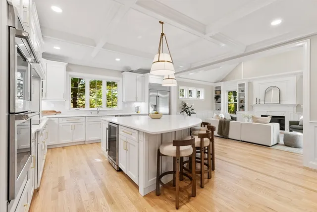 a large kitchen with a table and chairs