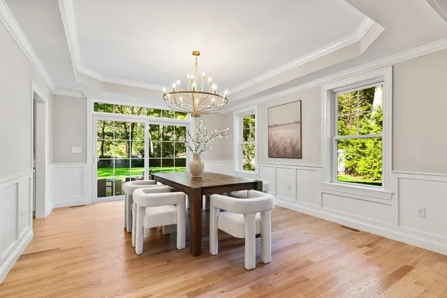 a view of a livingroom with furniture window and wooden floor