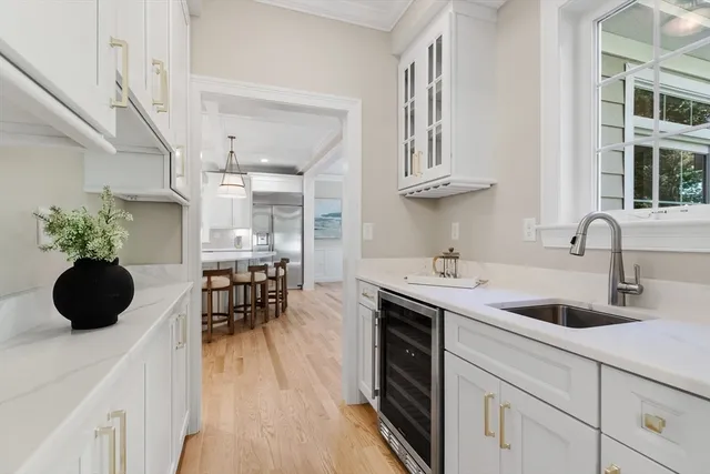 a kitchen with a sink a counter and cabinets