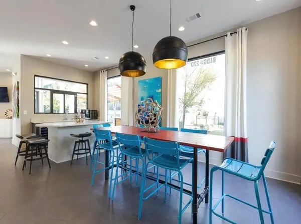 a view of a dining room with furniture window and outside view