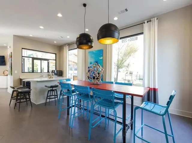 a view of a dining room with furniture window and outside view