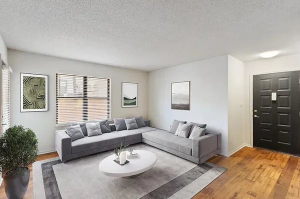 a living room with furniture and a large window