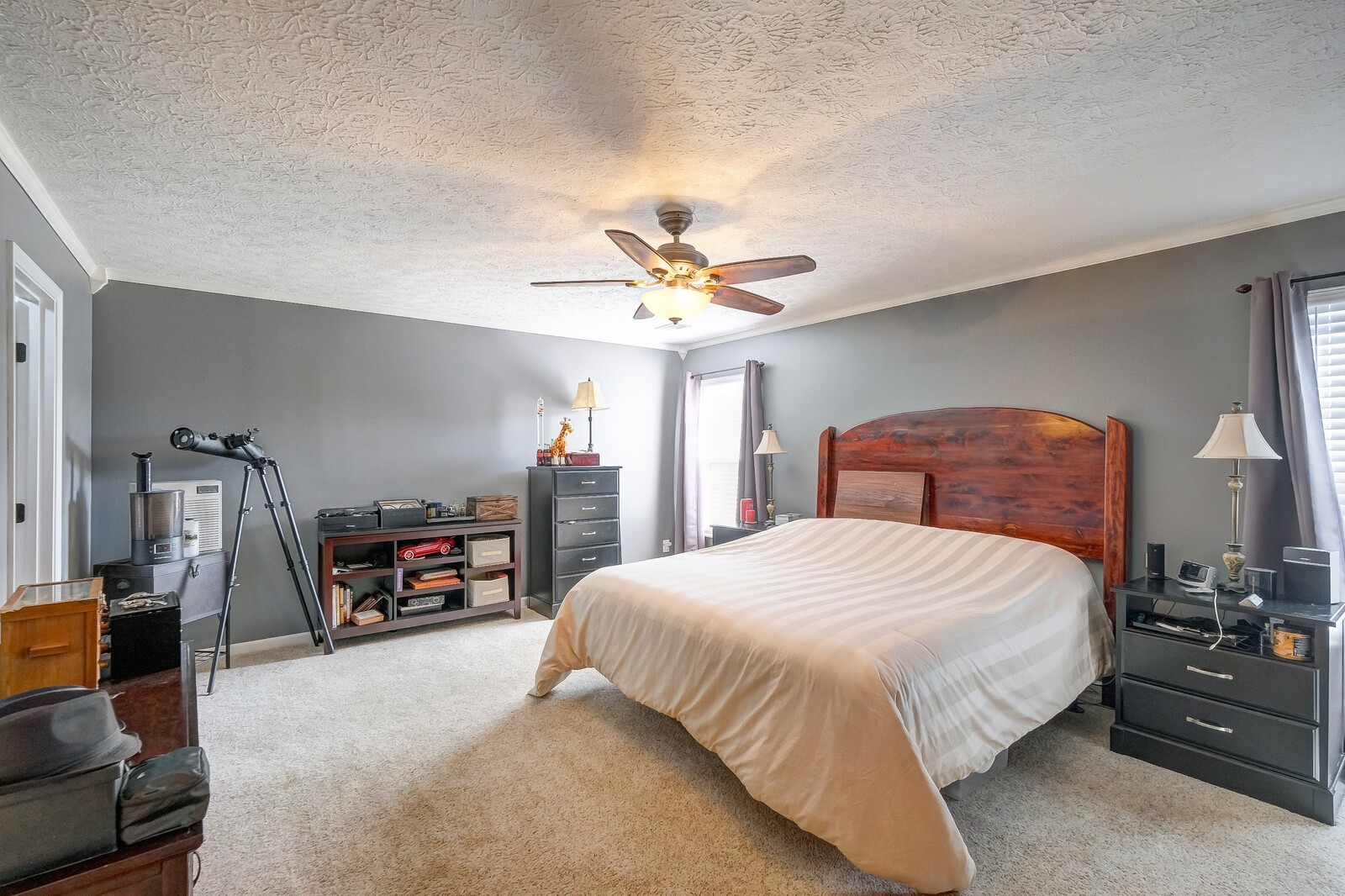 3904 Stephens Ridge Way Antioch, TN 37013 - Photo 12 of 17 a bedroom with a bed a dresser and a chandelier