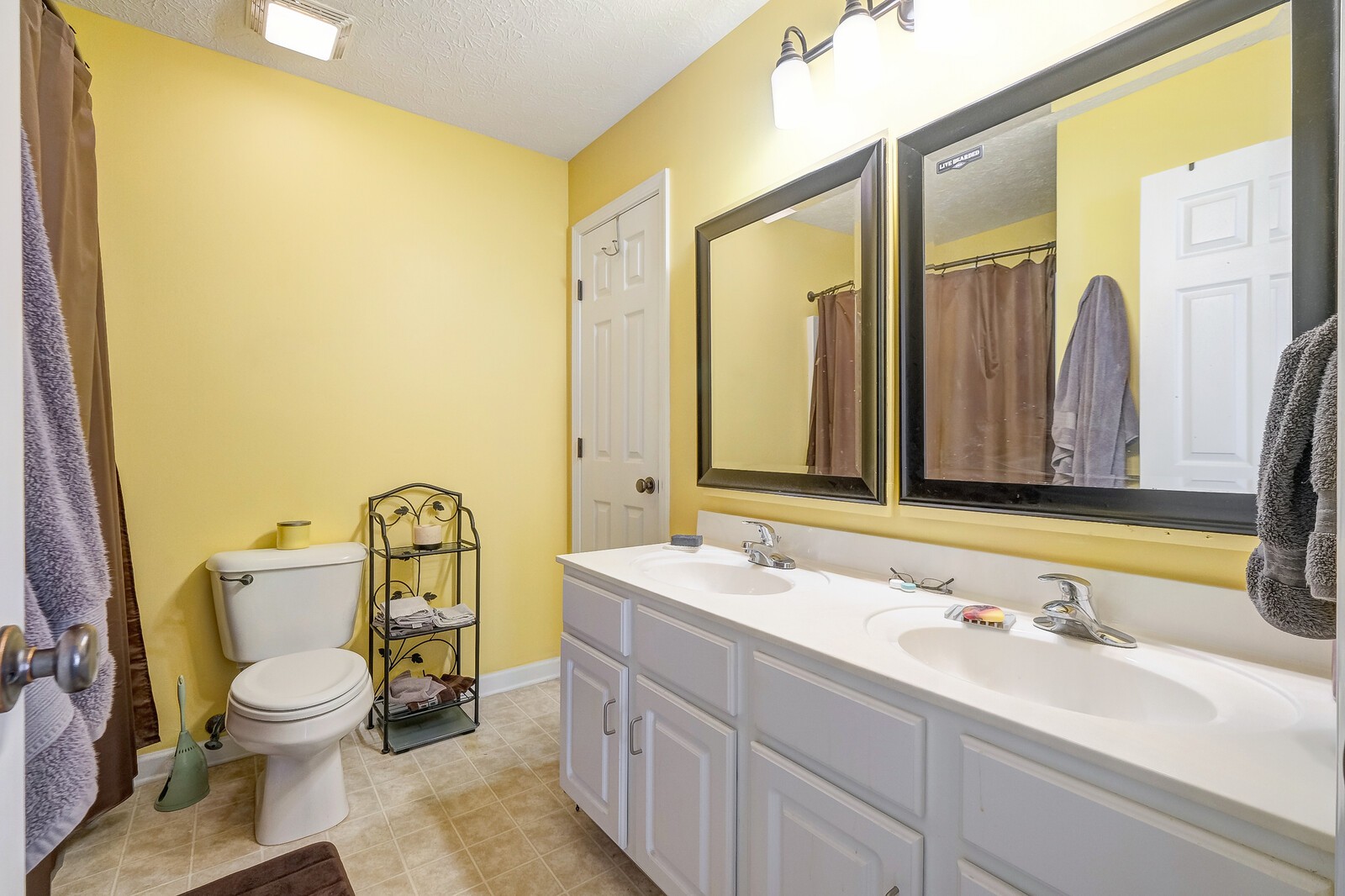 3904 Stephens Ridge Way Antioch, TN 37013 - Photo 13 of 17 a bathroom with a granite countertop toilet sink and mirror