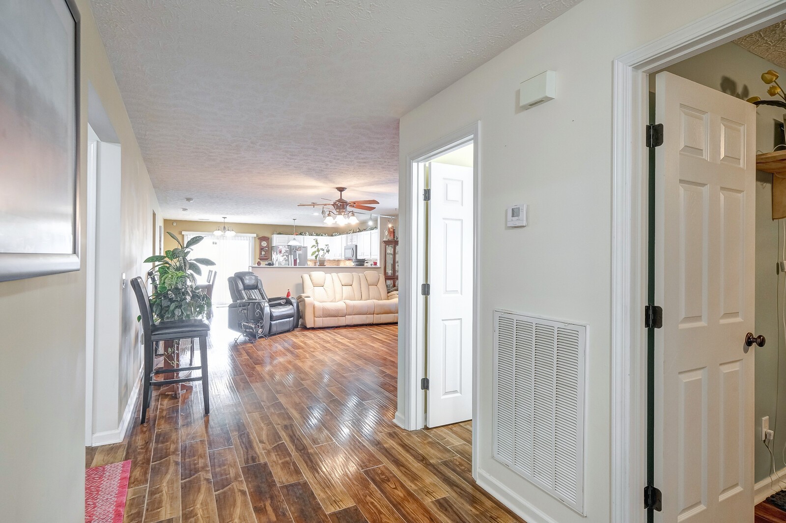 3904 Stephens Ridge Way Antioch, TN 37013 - Photo 2 of 17 a view of a hallway with wooden floor and furniture