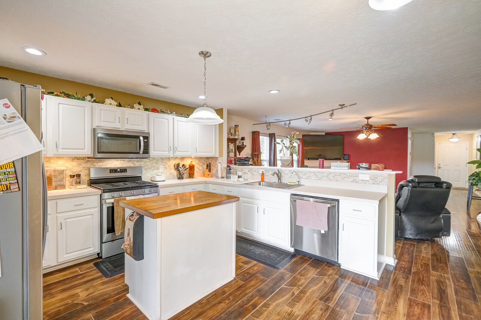 3904 Stephens Ridge Way Antioch, TN 37013 - Photo 3 of 17 a kitchen with stainless steel appliances kitchen island granite countertop a stove and a sink