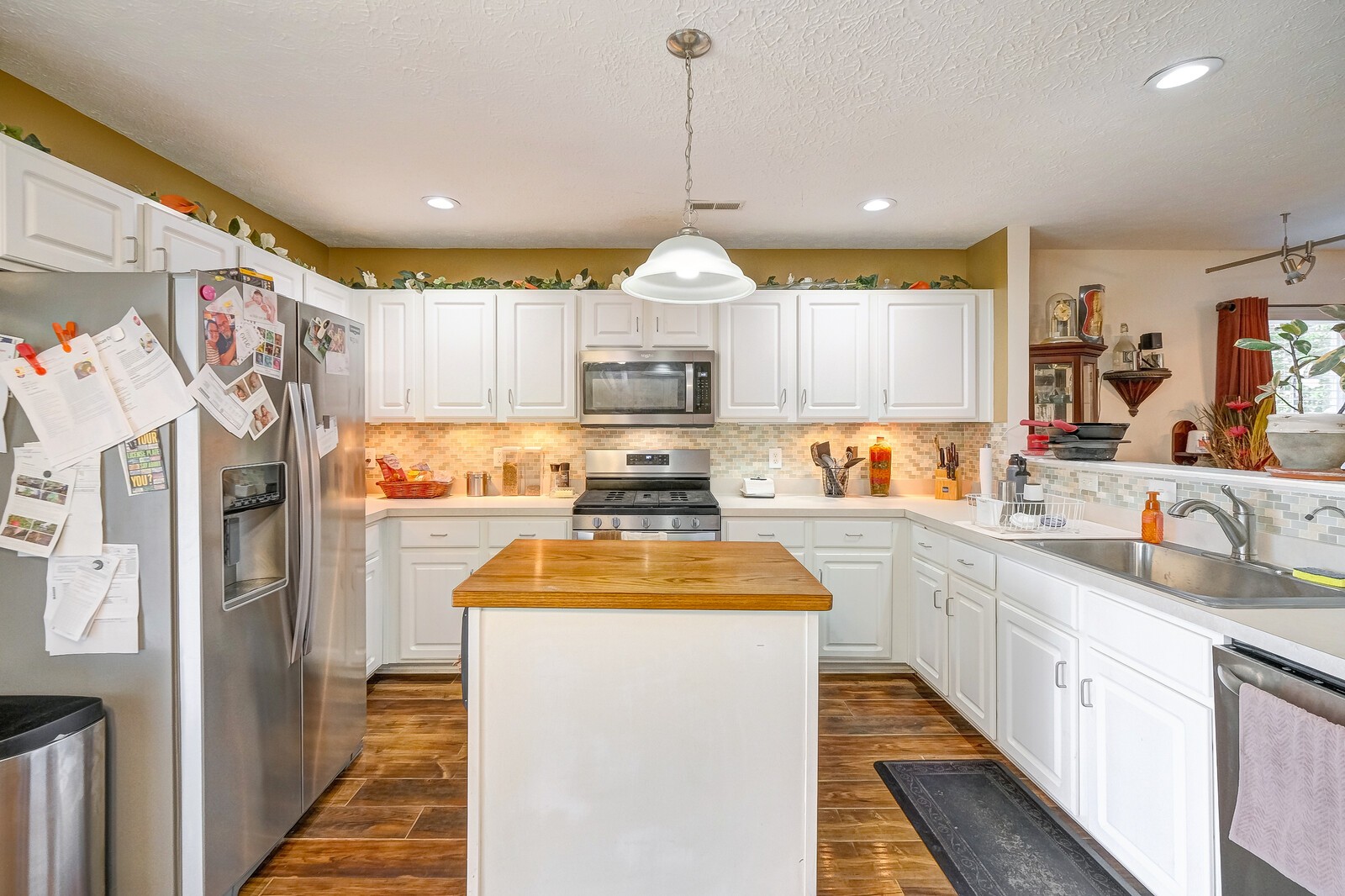 3904 Stephens Ridge Way Antioch, TN 37013 - Photo 5 of 17 a kitchen with wooden cabinets stove and refrigerator