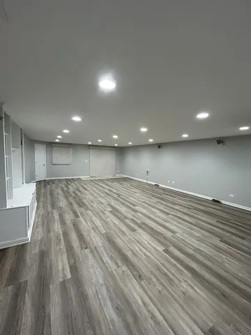 an empty room with wooden floor