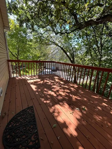 a view of balcony with wooden floor