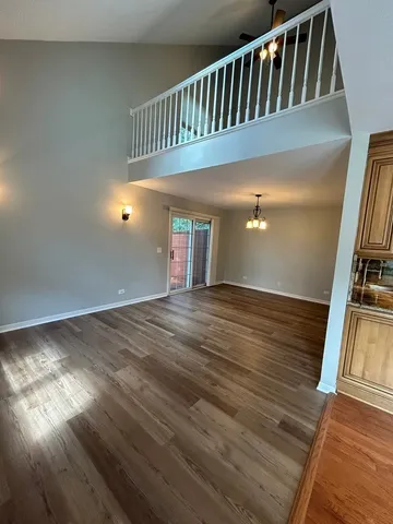 a view of staircase with wooden floor