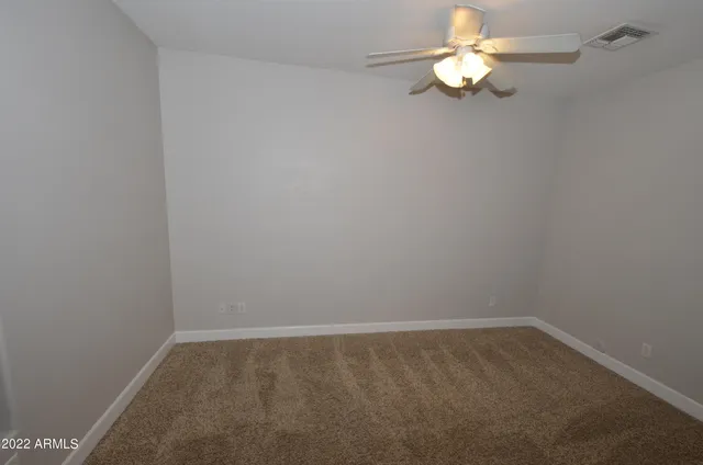 an empty room with a view of a bathroom