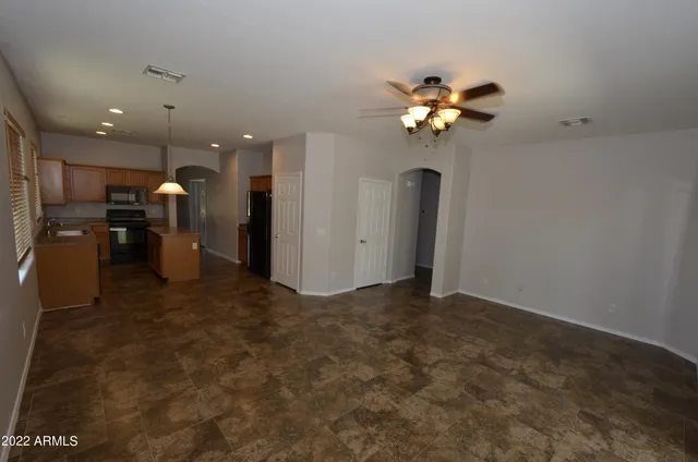 a view of a utility room with a ceiling fan