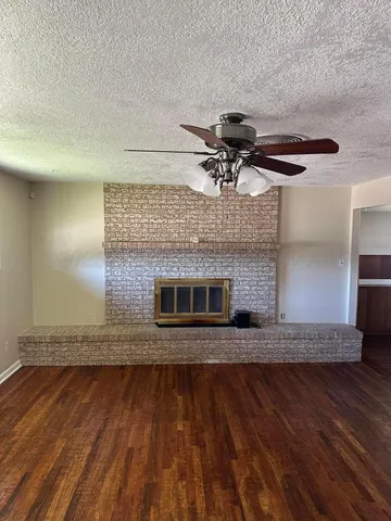 a view of living room with wooden floor