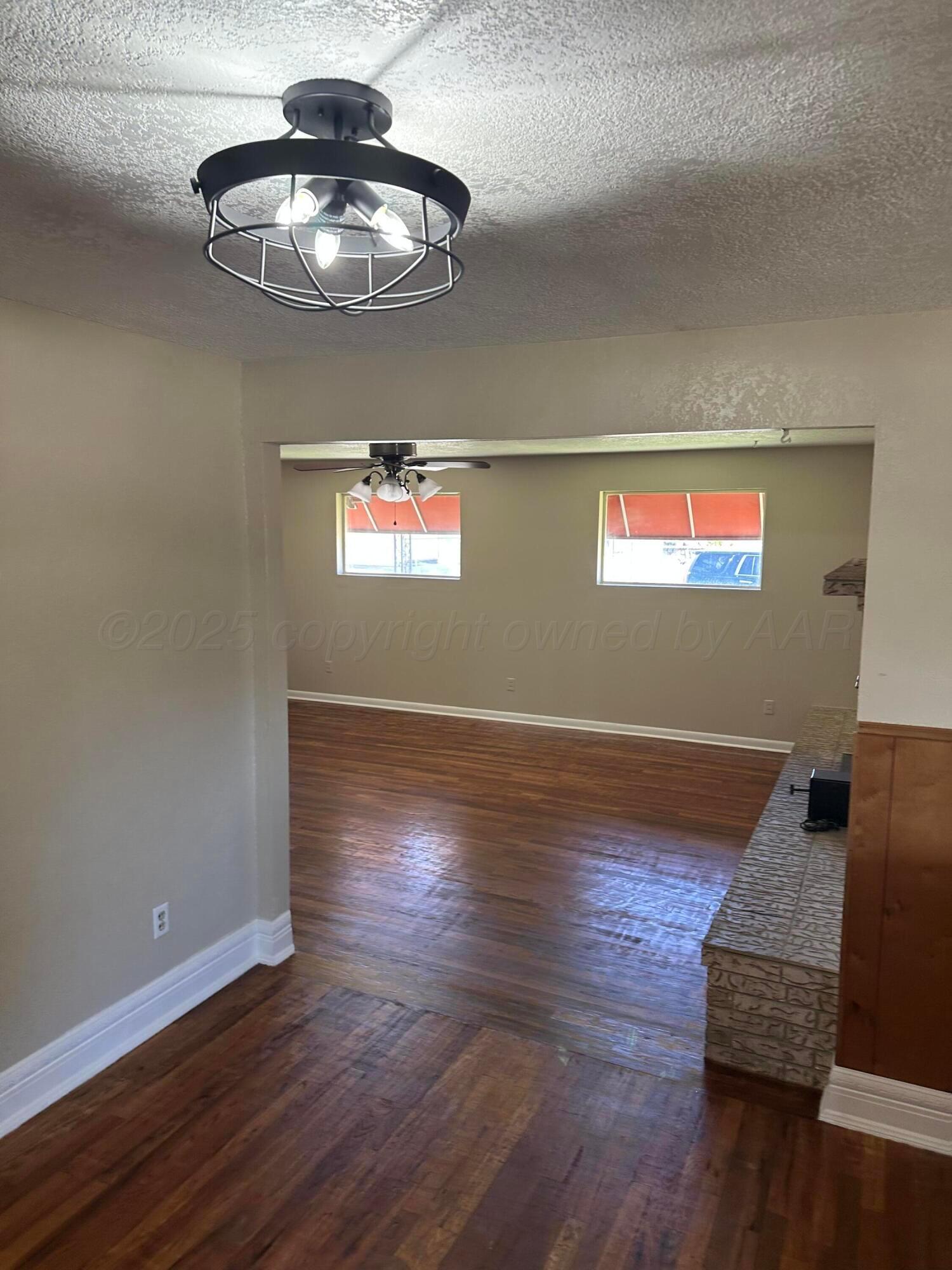 1021 Jackson Street Borger, TX 79007 - Photo 25 of 26 a view of a livingroom with wooden floor