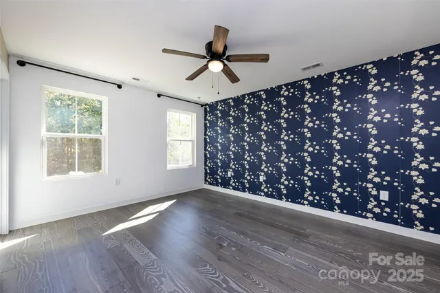 a view of entryway and wooden floor