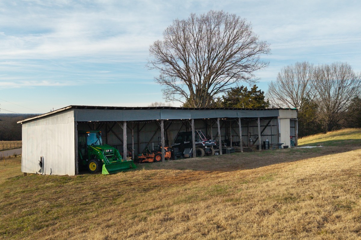 4900 Manners Road Lebanon, TN 37087 - Photo 9 of 21 a view of a house with a yard and garage