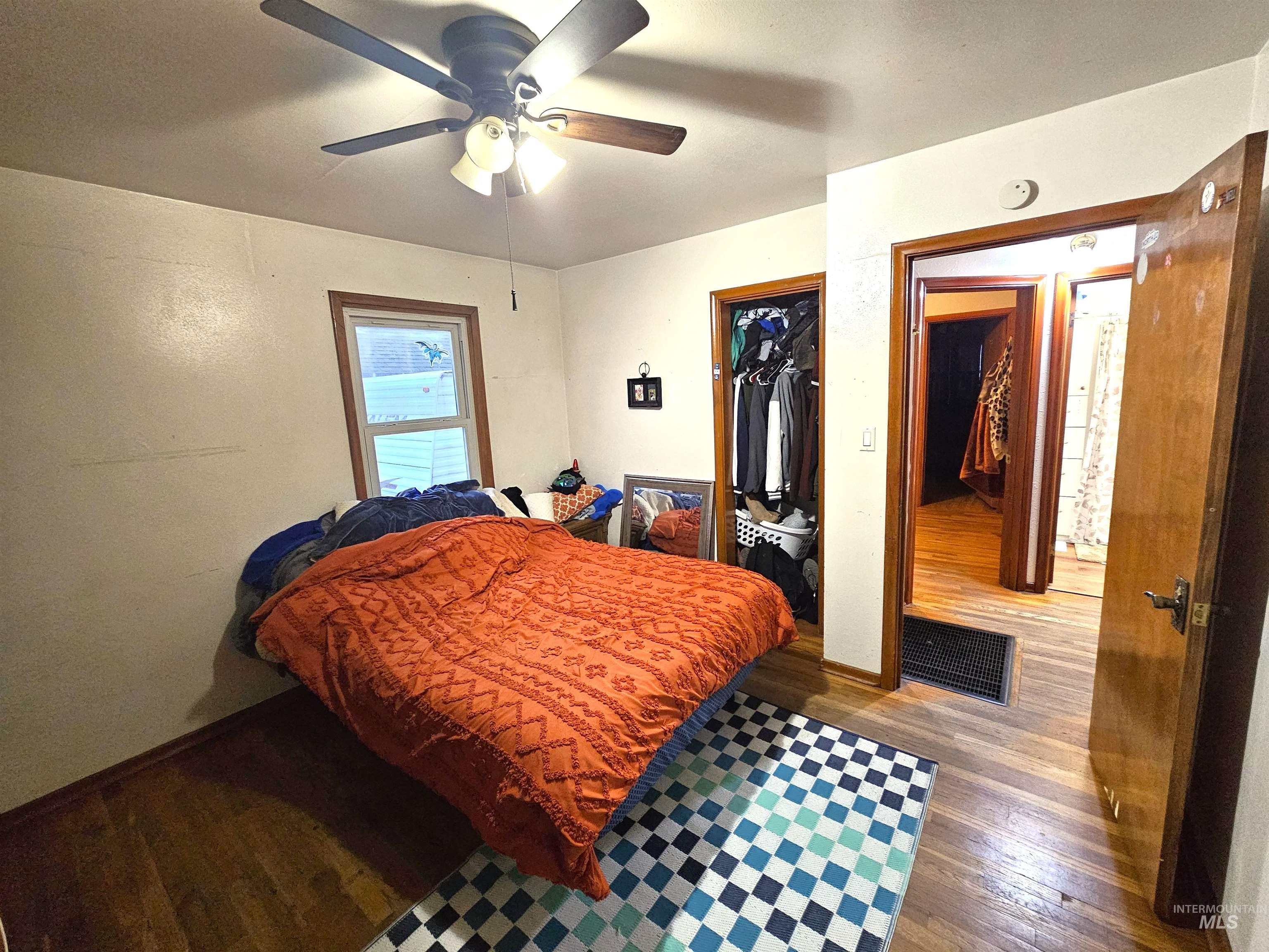 616 12th Street Clarkston, WA 99403 - Photo 14 of 24 Bedroom featuring hardwood / wood-style flooring, ceiling fan, and a closet