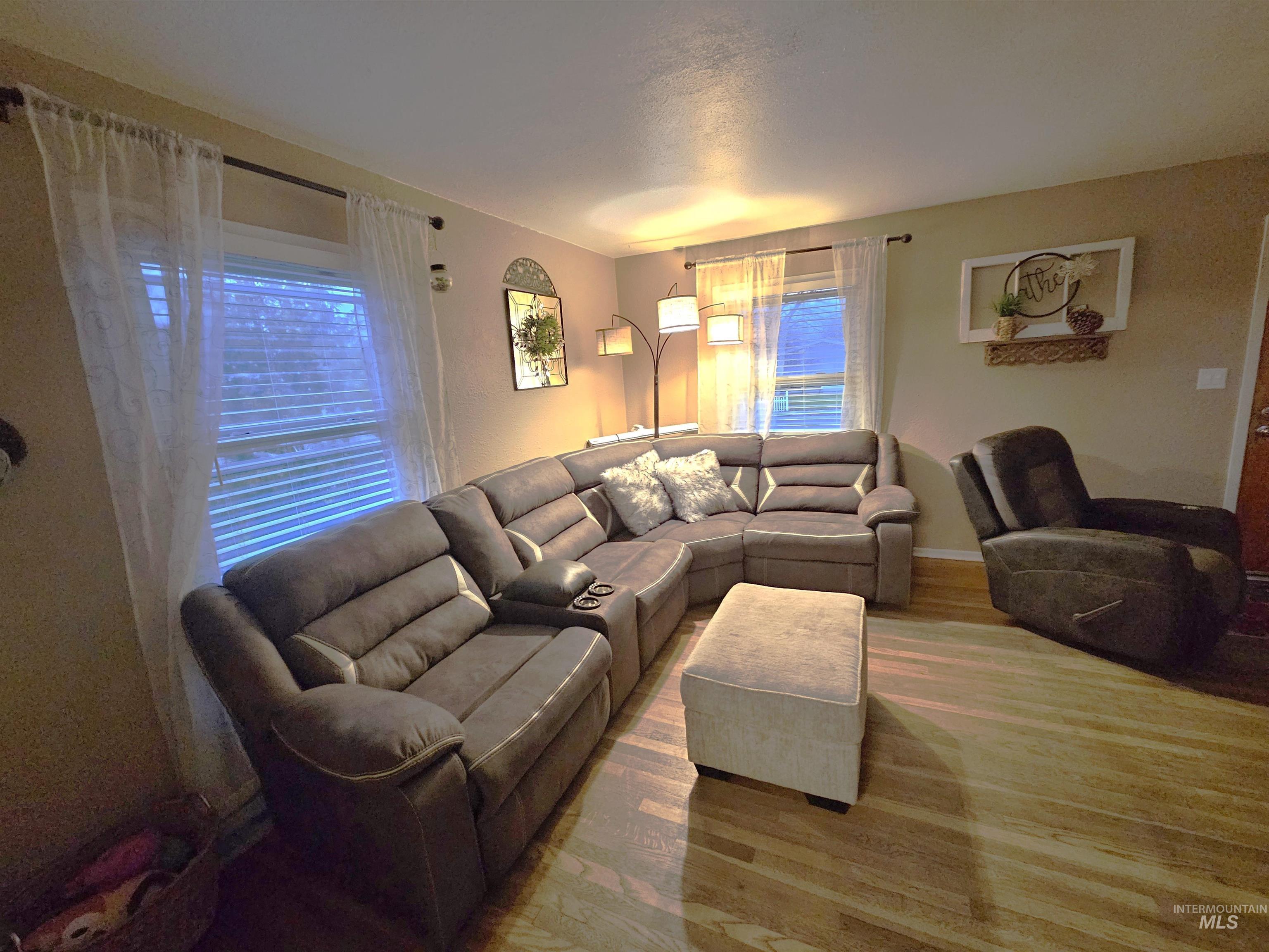 616 12th Street Clarkston, WA 99403 - Photo 3 of 24 Living room with wood finished floors