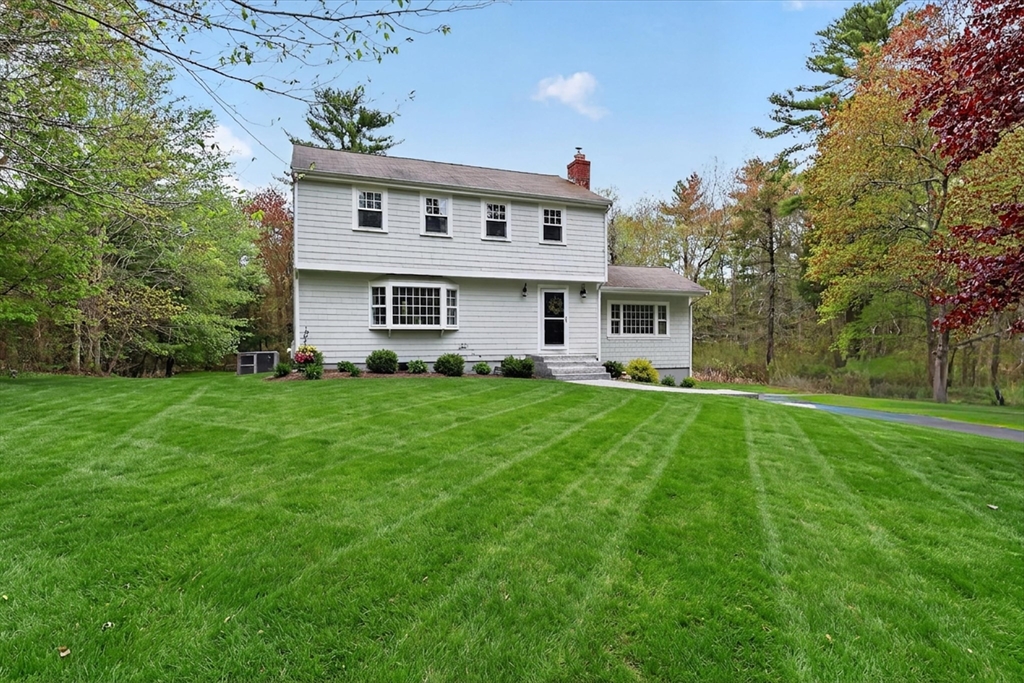 59 First Parish Road Norwell, MA 02061 - Photo 1 of 37 a front view of house with yard and green space