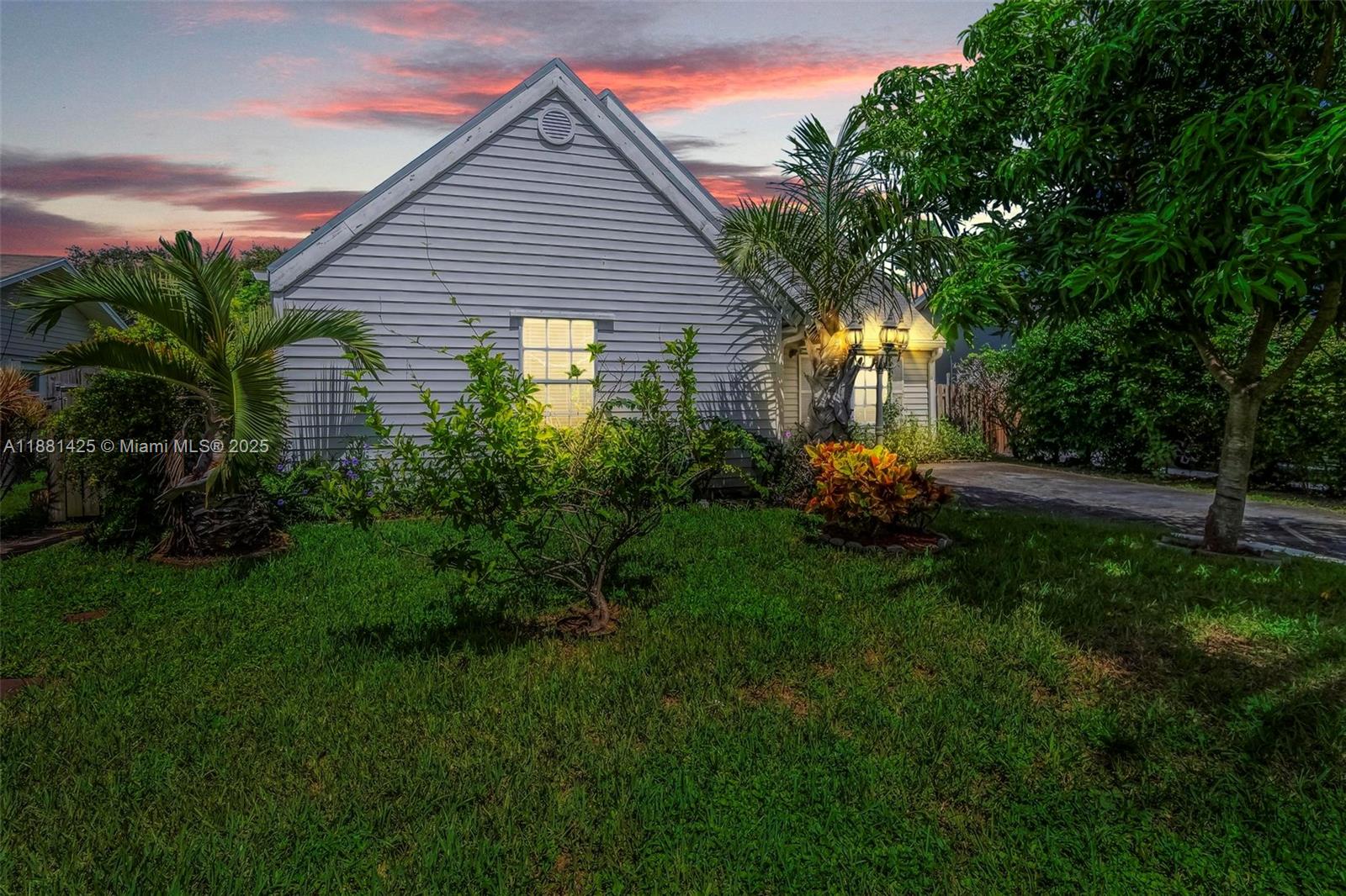 5119 Oak Hill Road Delray Beach, FL 33484 - Photo 1 of 48 a view of a house with garden and plants