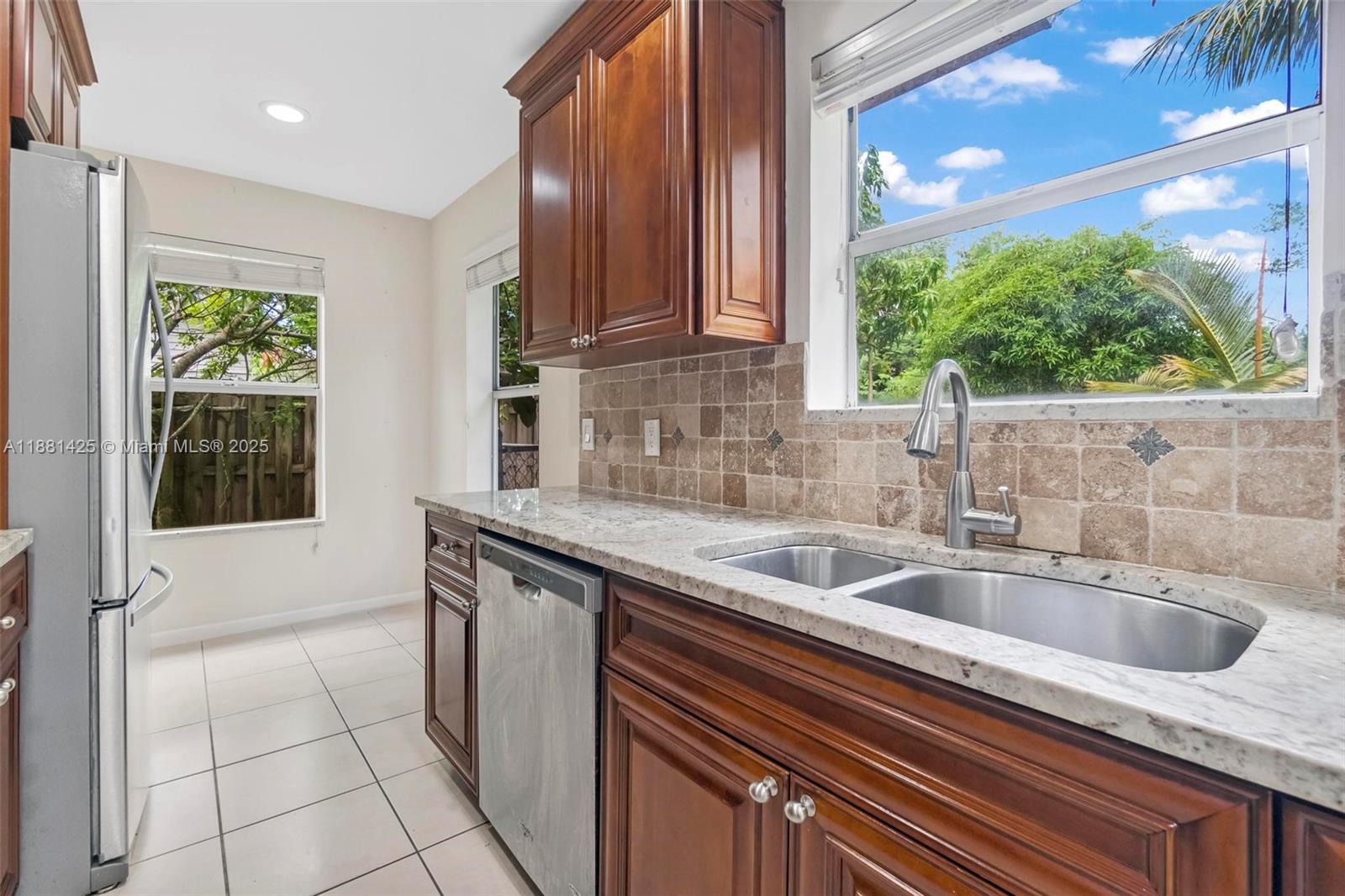5119 Oak Hill Road Delray Beach, FL 33484 - Photo 12 of 48 a kitchen with a sink and a window